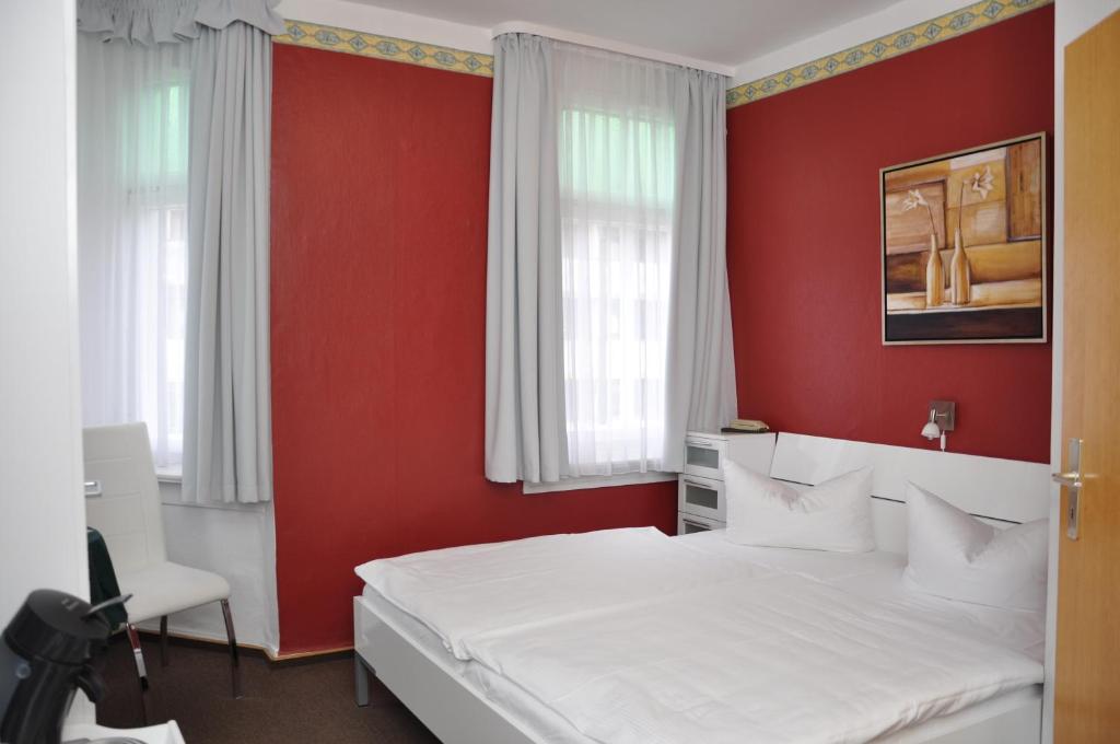 Postel nebo postele na pokoji v ubytování Hotel An der Kapelle