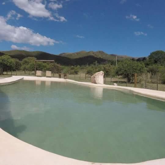 a large pool of water in a park at TiniHouse AguadePiedra in Villa Giardino