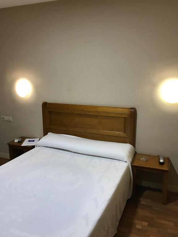 Postel nebo postele na pokoji v ubytování Hotel Anfora