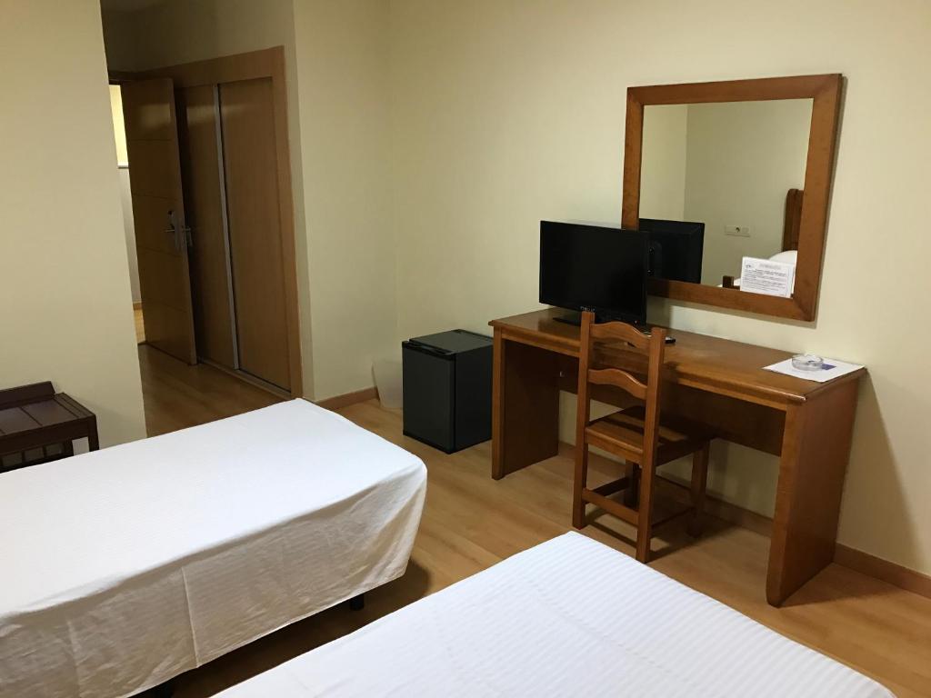 TV a/nebo společenská místnost v ubytování Hotel Anfora