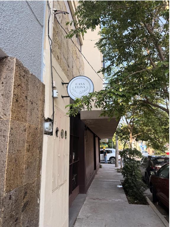 a building with a clock on the side of it at Casa Elisa - Expiatorio in Guadalajara