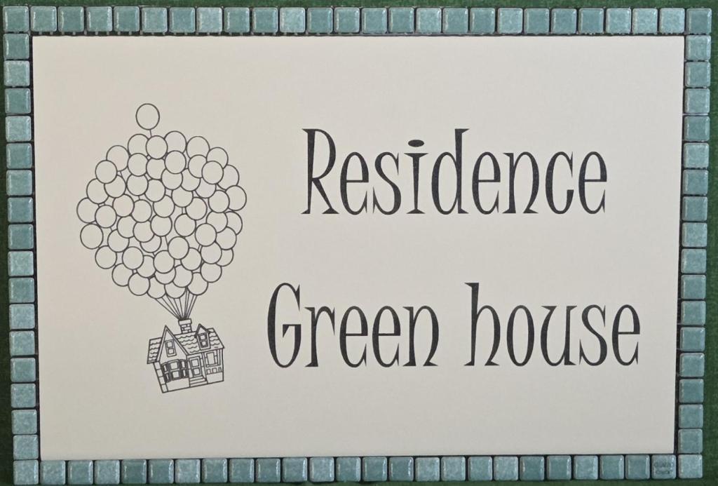a picture of a green house on a bunch of balloons at Green House Residence in Pinerolo