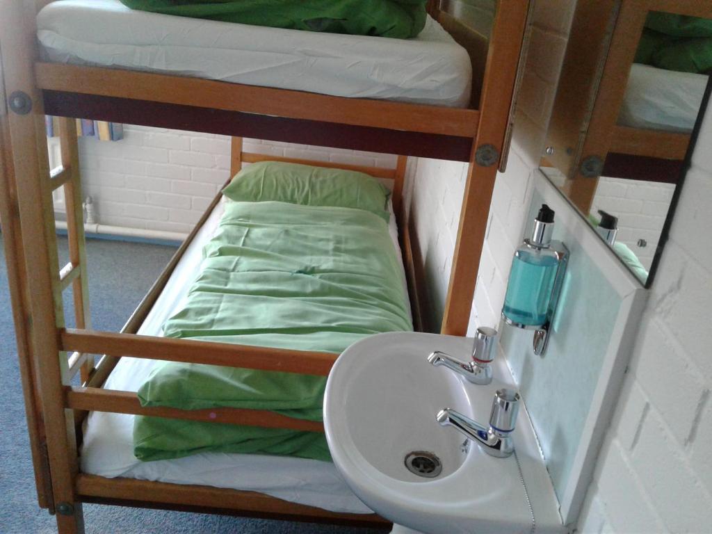 Postel nebo postele na pokoji v ubytování YHA Hawes