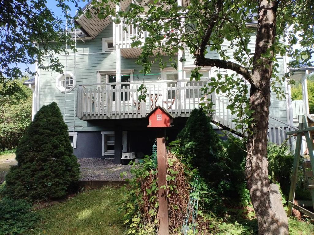 a bird house in front of a house at Heritage House at Villa Sofia in Lahti
