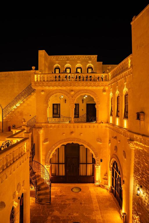 an old building with an entrance at night at MivanUrfa Otel in Urfa