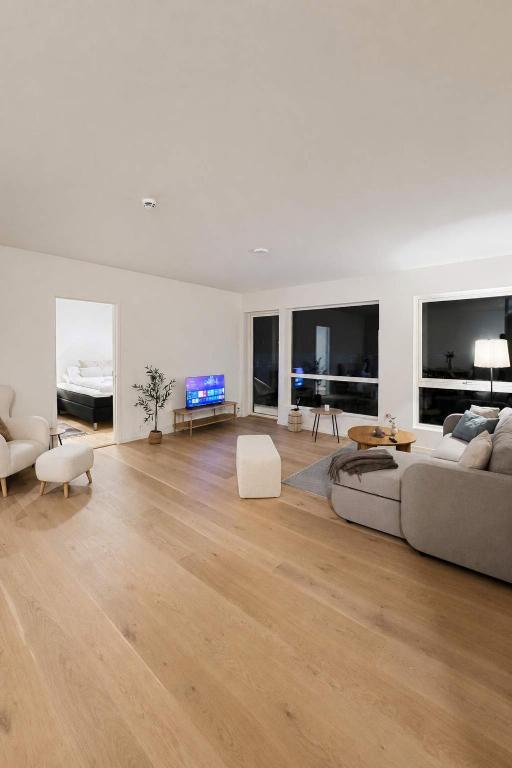a living room with a couch and a table at The Nordic - 2BR in Voss - The Voss Collection in Vossevangen
