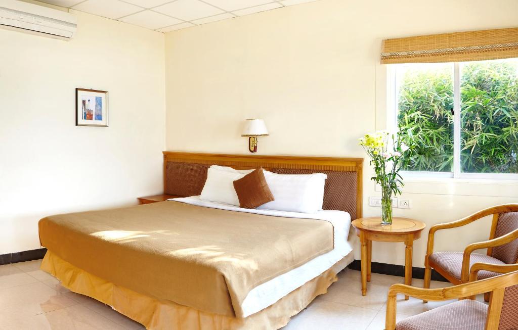 Postel nebo postele na pokoji v ubytování Savana Lake Resort