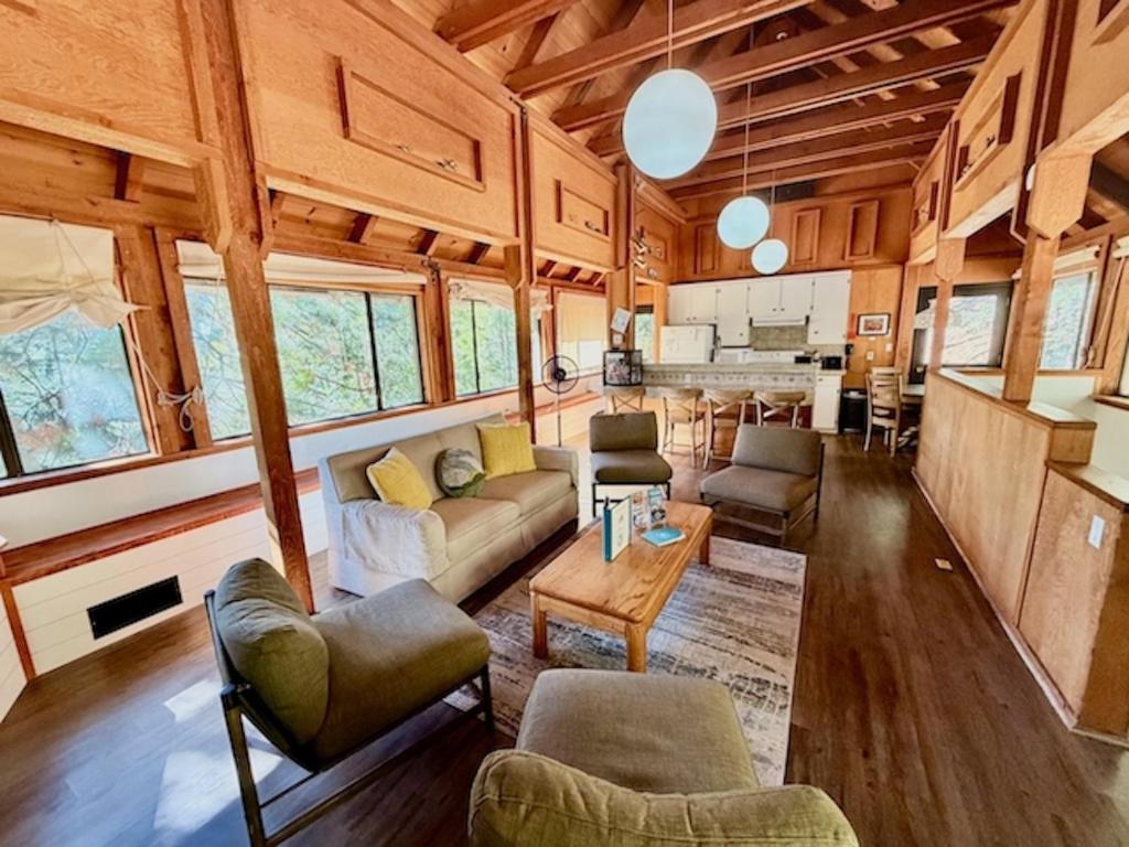 a living room with a couch and a table at Views inside Yosemite-Timber Lodge-Sleeps 6 in Yosemite West