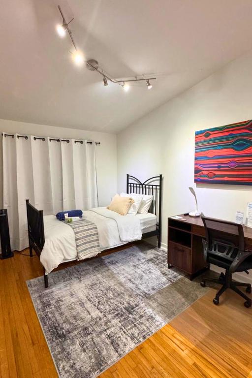 a bedroom with a bed and a desk and a piano at North York Quiet Room#2 in Toronto