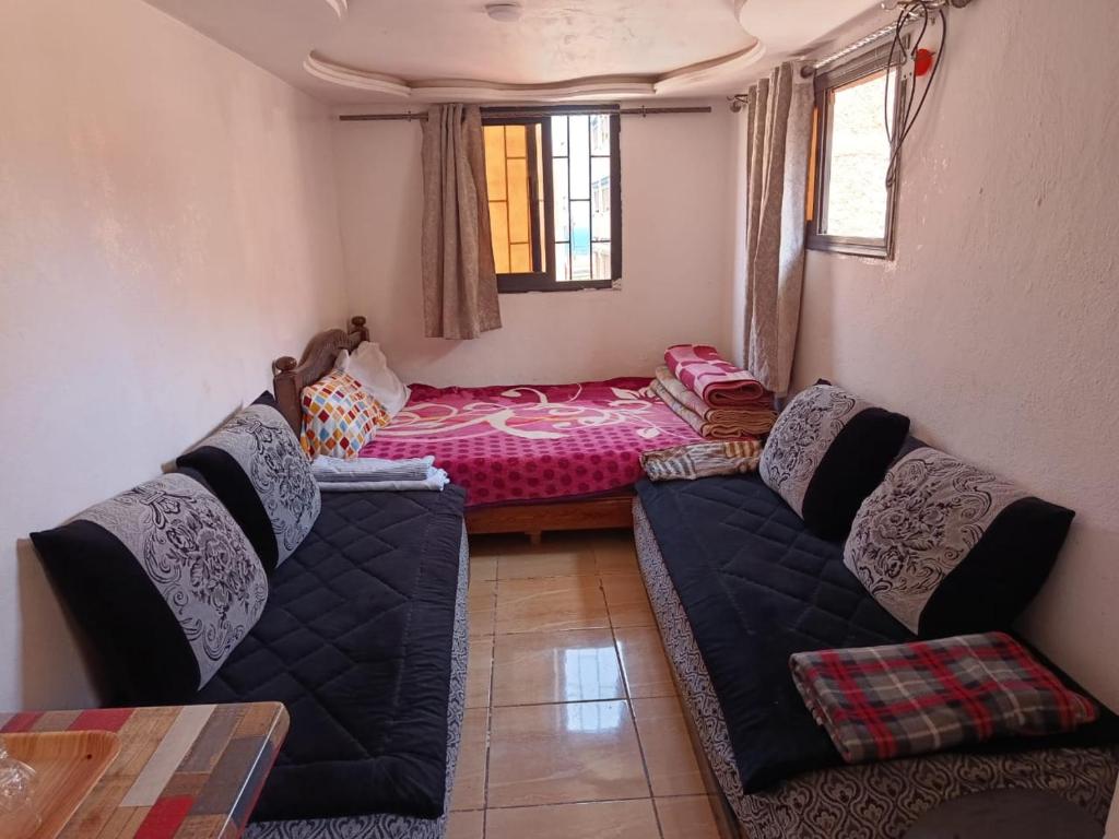 a living room with two couches and a bed at tbs1 in Safi