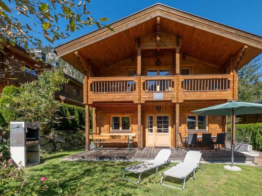 a log home with a deck and patio at Waldberg in Krimml