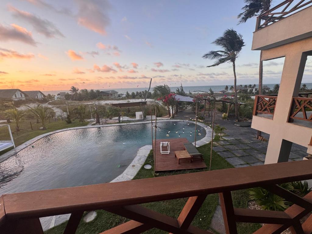 a view of a swimming pool from a balcony at Refúgio prea in Cruz