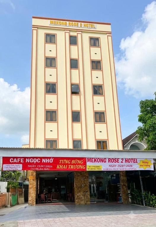a large building with a sign in front of it at Mekong Rose 2 in Bình Thủy