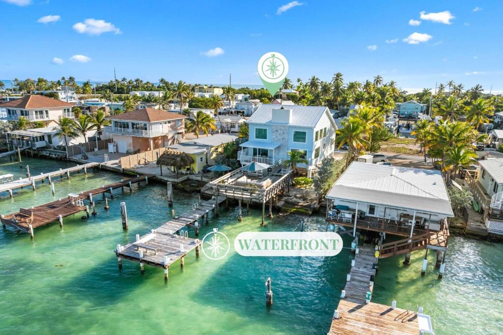 an aerial view of a marina with houses at Blanco Bay Key in Duck Key