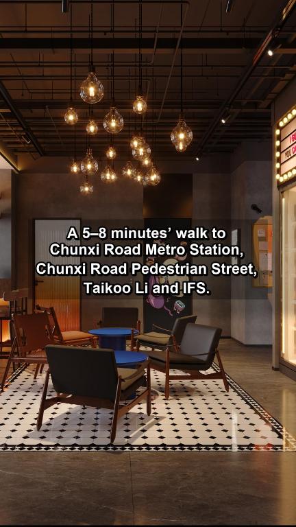 a room with chairs and a table and a sign at Merica Hotel-ChengDu Chunxi Road in Chengdu