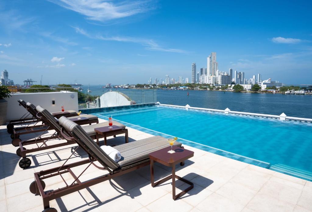 a swimming pool on the roof of a building at GHL Arsenal Hotel in Cartagena de Indias