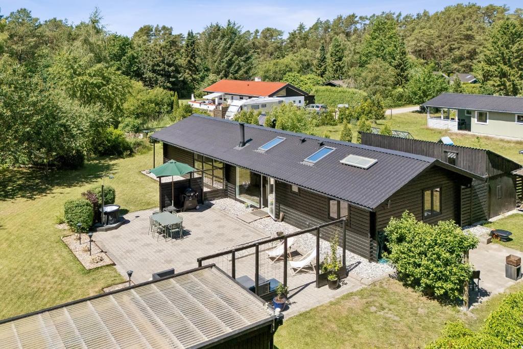 an overhead view of a house with a patio at Luxury Retreat Surrounded By Nature in Rønde