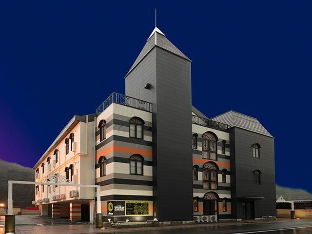 a building with a clock tower on top of it at Hulamoon in Maizuru