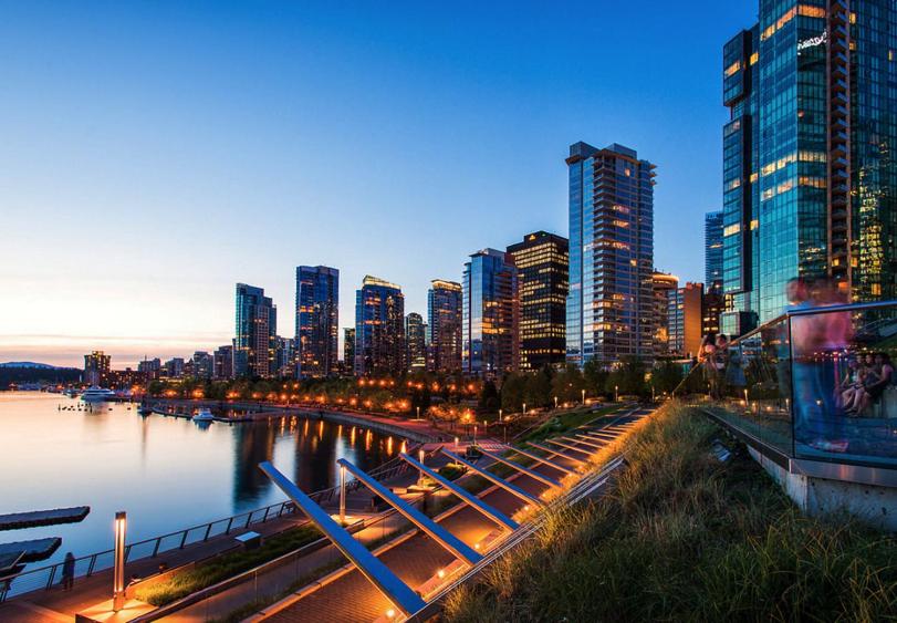 a view of a city with a river and tall buildings at Modern 2BR Luxury Apartment - Amazing Location, Steps To Everything! in Vancouver