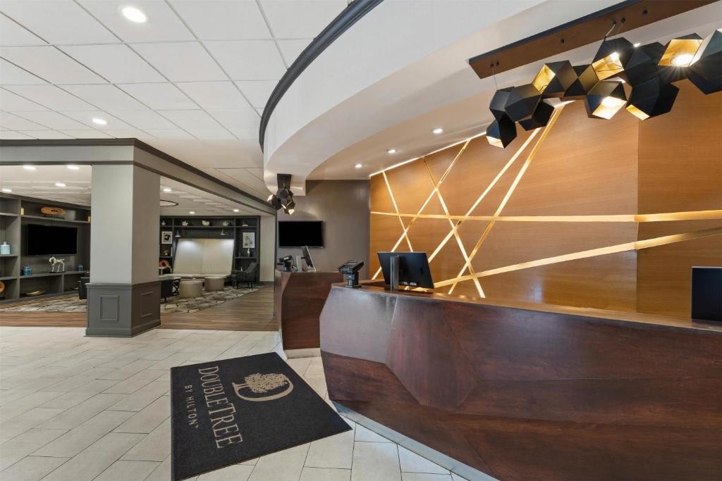a lobby of a hotel with a reception desk at DoubleTree by Hilton Hotel Wilmington in Wilmington