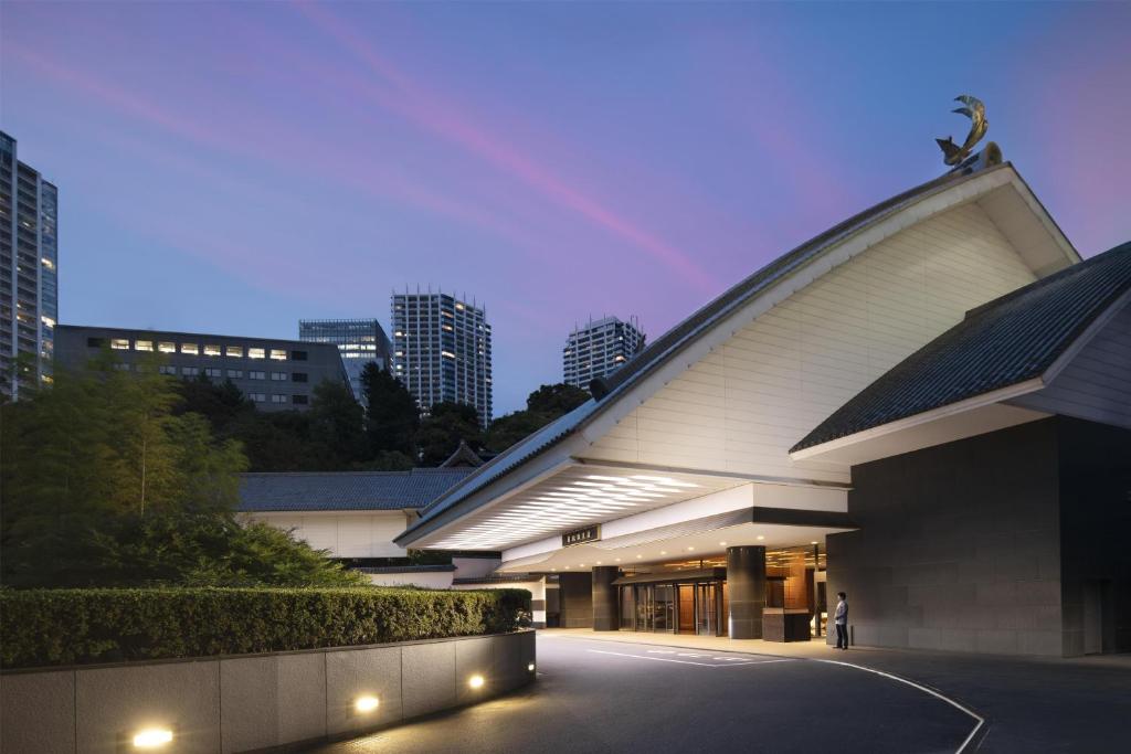 a building with lights in front of a city at Gajoen Tokyo in Tokyo