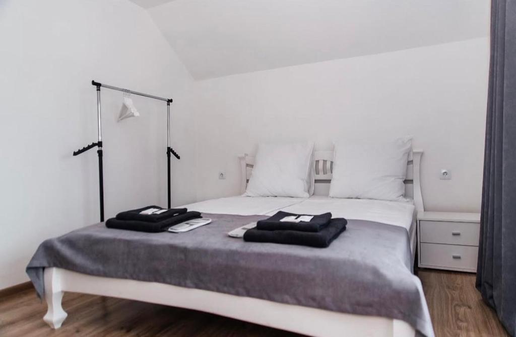 a bedroom with a large bed with two pillows on it at Anamyra in Mizhhirya