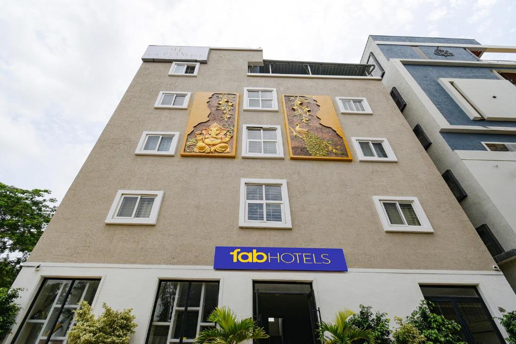 a building with a painting of a lion on it at FabHotel Latitude in Hyderabad