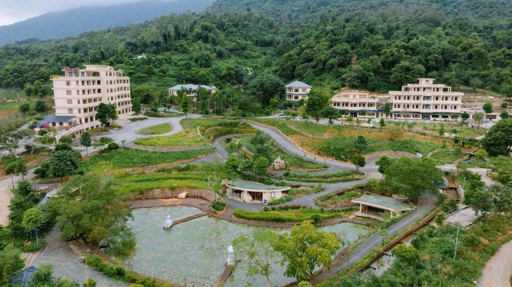 an aerial view of a park with buildings and trees at Bavieco Resort in Yên Bài