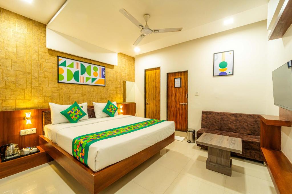 a bedroom with a large bed in a room at Treebo Ten Eleven Grand, Scheme 78 in Indore