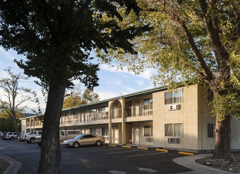 a building with cars parked in a parking lot at Best Western Carson City Hotel in Carson City