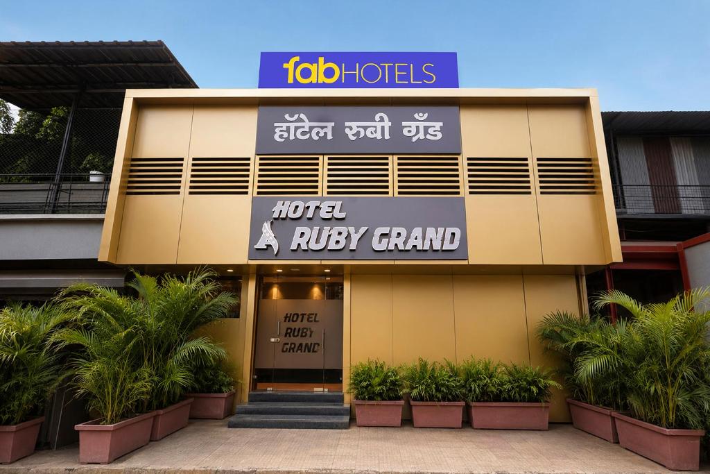 a building with a sign on the front of it at FabHotel Ruby Grand in Mumbai