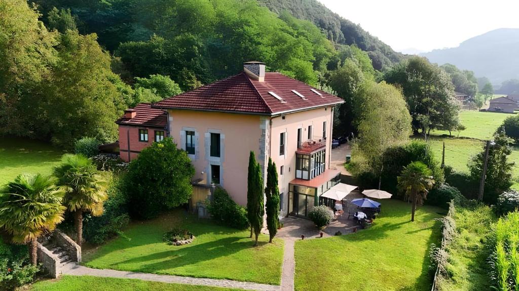 an aerial view of a house on a green field at Hotel Boutique Villa de Palacios - Palacio de Aras in San Miguel de Aras