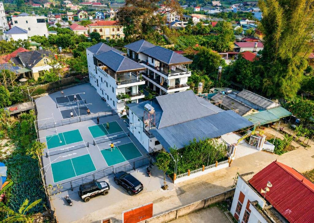 an aerial view of a house with a tennis court at Home Mộc Mer Mộc Châu in Mộc Châu