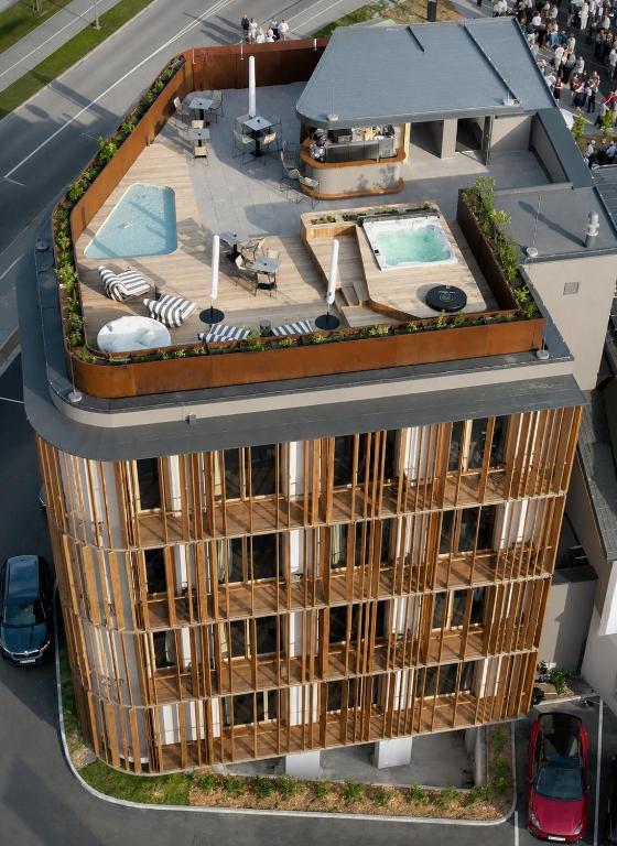 an overhead view of a building with a swimming pool at Hotel KUNST in Krško
