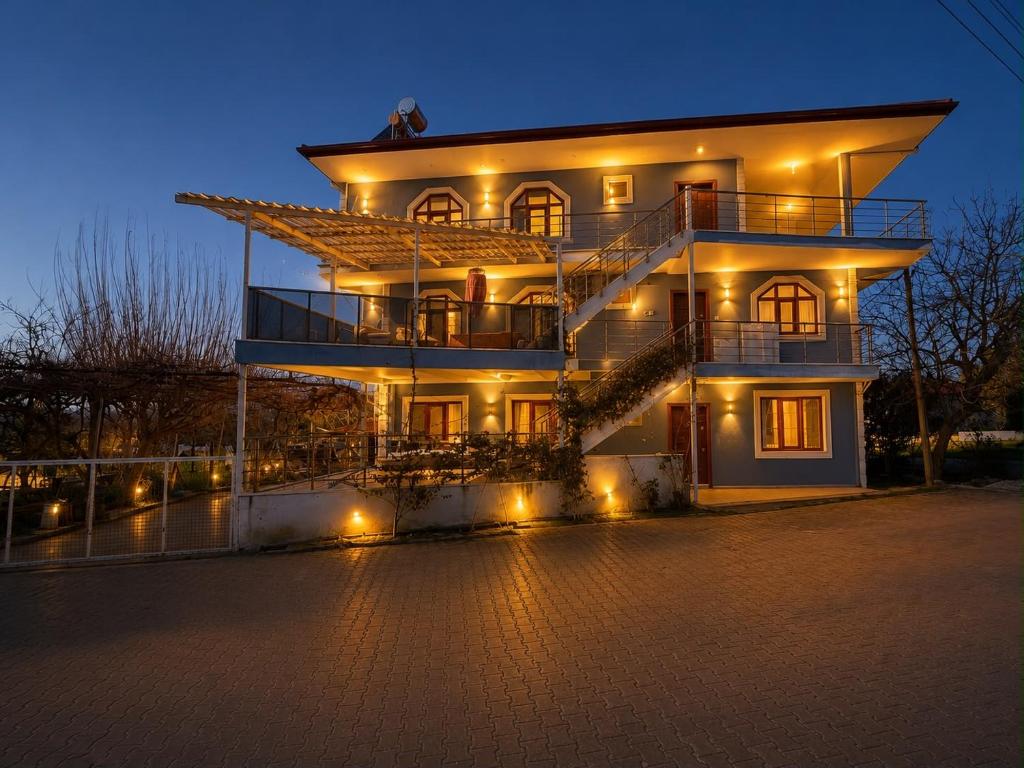 a large building with lights in front of it at Deluxe apart in Pamukkale