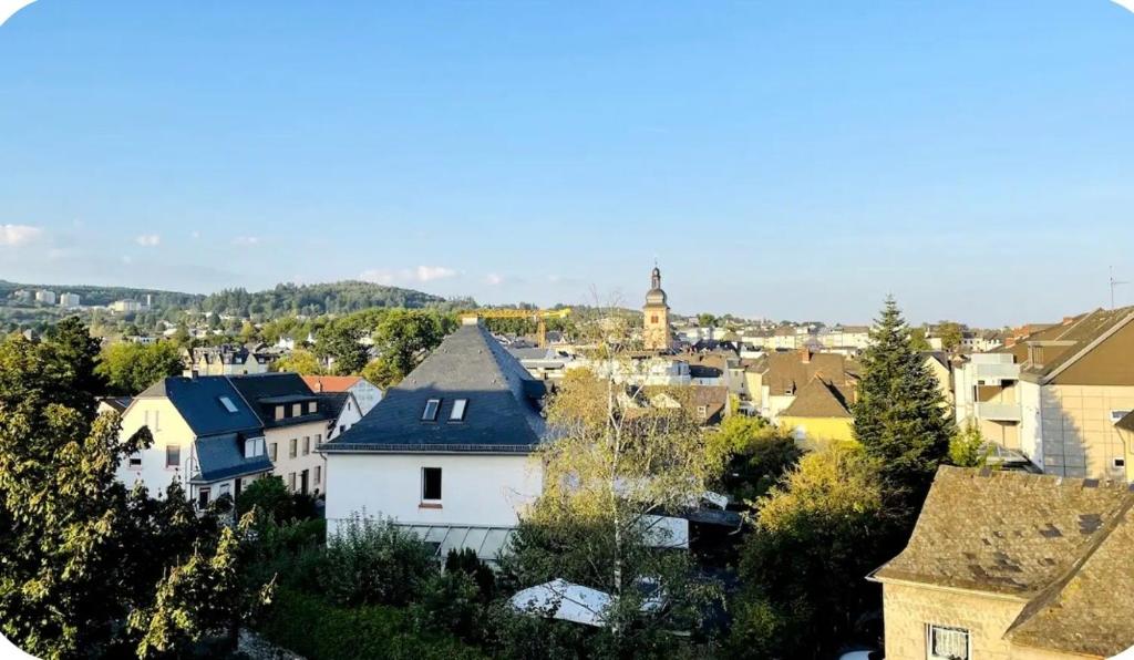 a view of a city with houses and a church at Foundry ONE LoftQuartier in Jugenstilvilla in Wittlich