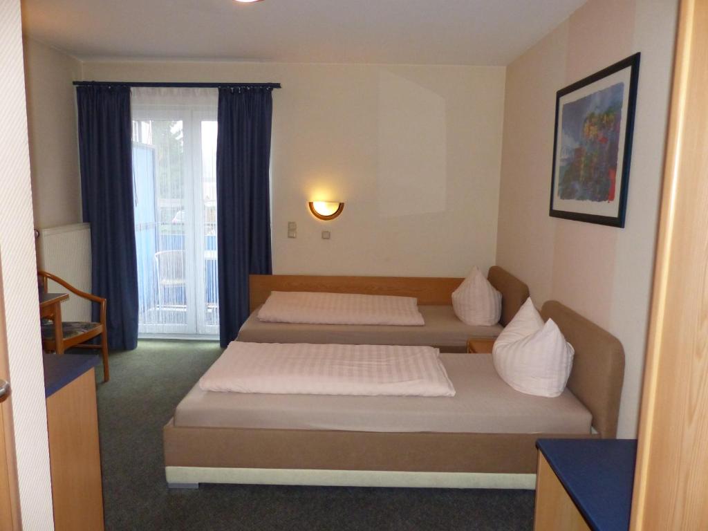 Postel nebo postele na pokoji v ubytování Hotel Aggertal