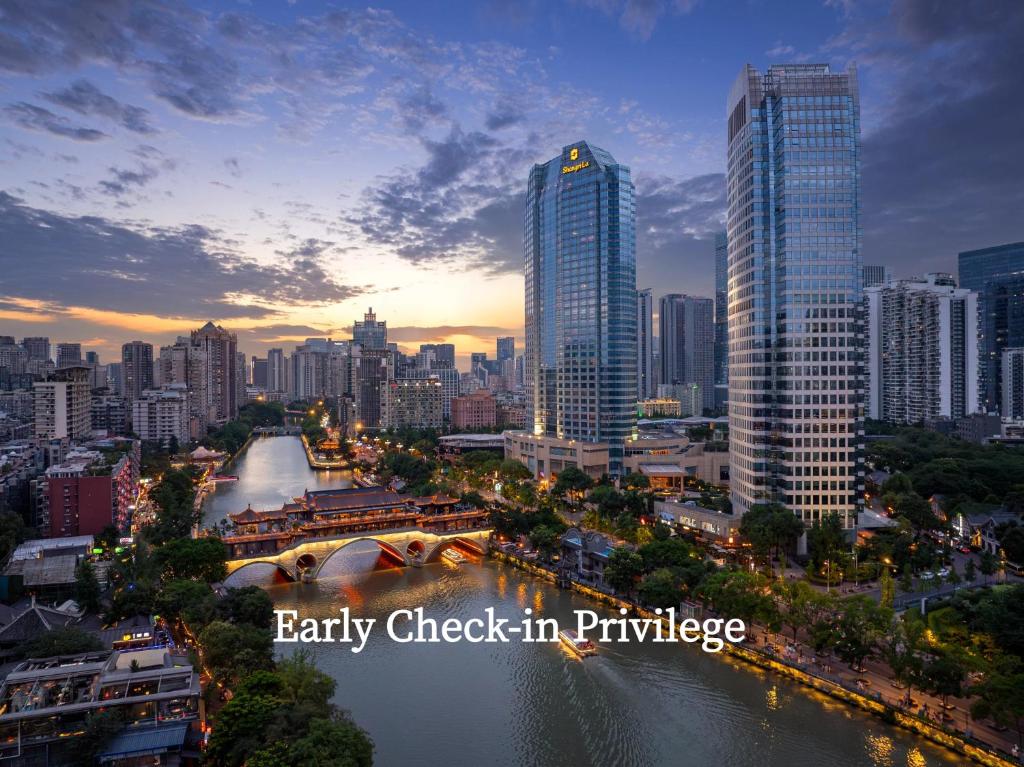 a city with tall buildings and a river at Shangri-La Chengdu in Chengdu
