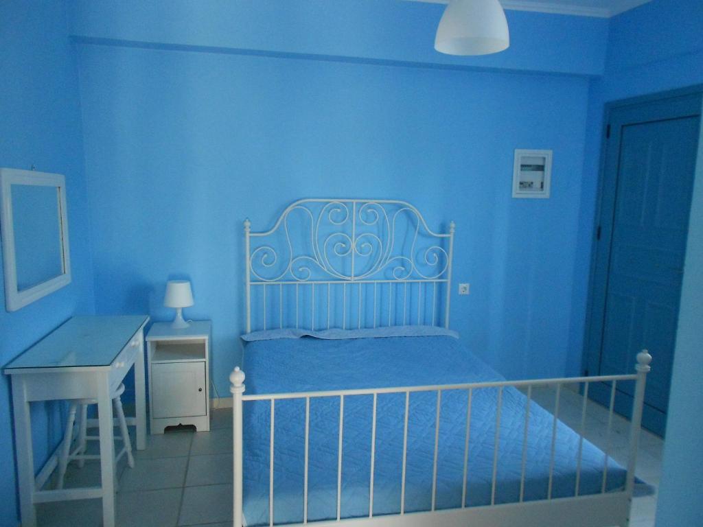 Posteľ alebo postele v izbe v ubytovaní Blue White House