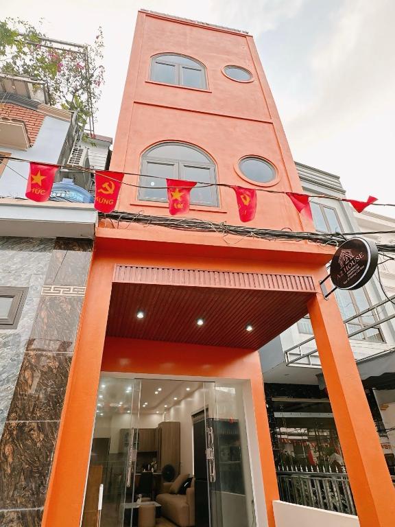 a tall building with red lights on it at A2 House Cát Bà in Cat Ba