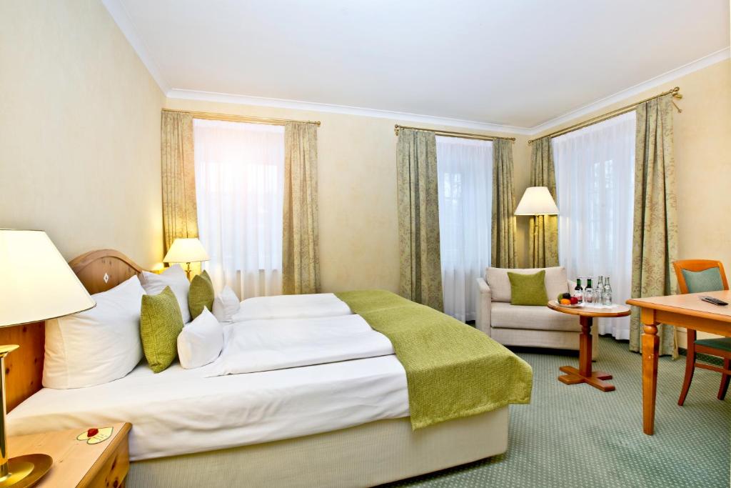 Postel nebo postele na pokoji v ubytování Hotel Freisinger Hof