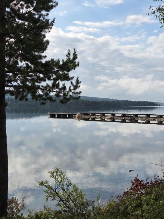 a view of a lake with a dock at Villa Sevettijärvi in Sevettijärvi
