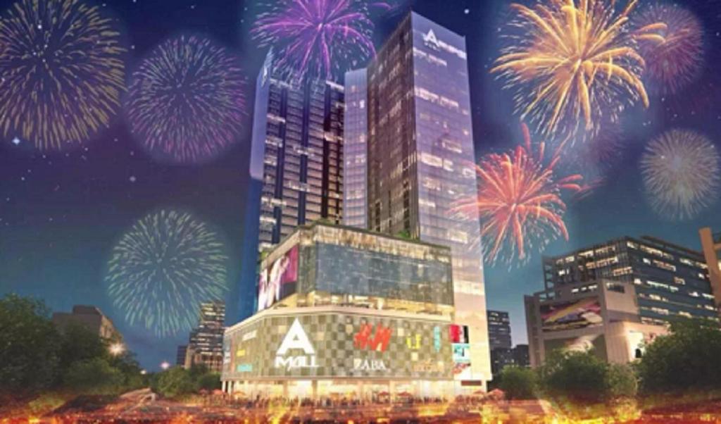 a rendering of a city with fireworks in the sky at Pengman Beijing Road A-mall Apartment in Guangzhou