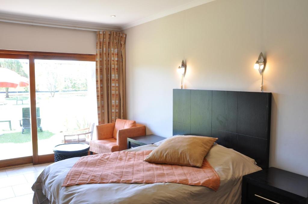 Postel nebo postele na pokoji v ubytování Planet Hotel HollyBum