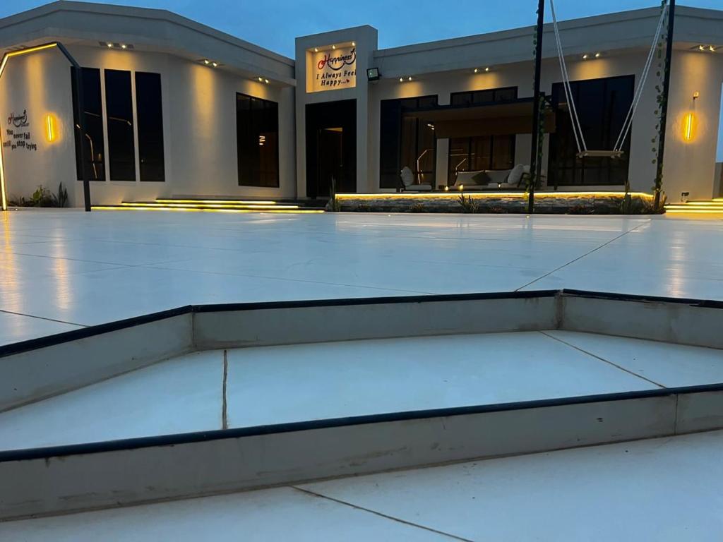 a empty parking lot in front of a building at هابينيس شاليه in Salalah