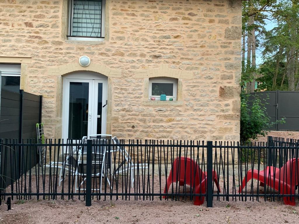 two stuffed animals in front of a house at La Maison Clémenso in Cluny