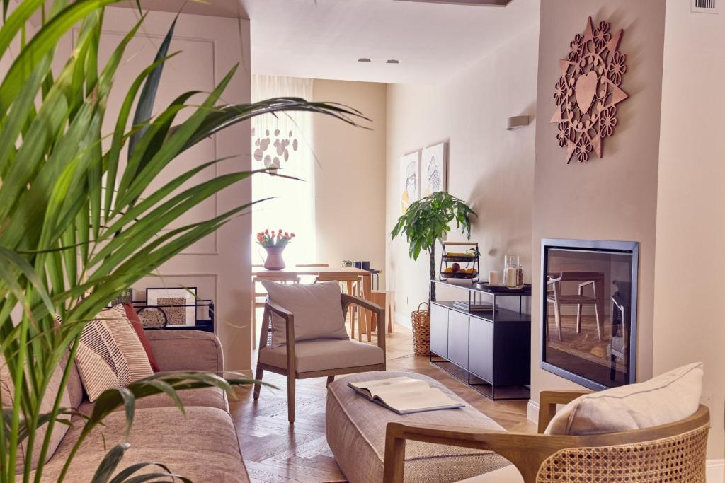 a living room with a couch and a fireplace at La Dimora Guest House in Castel di Sangro