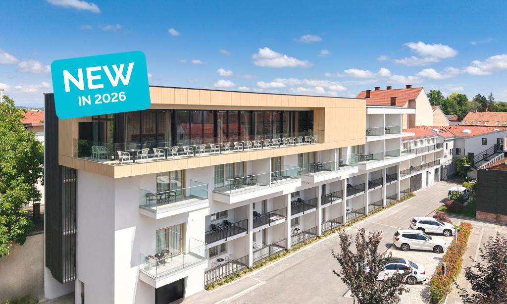 a building with a new in sign on it at Aminess Florian & Godler Hotel in Karlovac