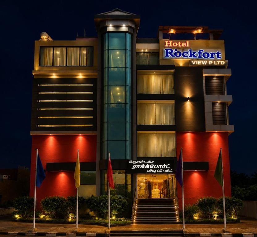 a hotel building with flags in front of it at Hotel Rockfort View by Park Elanza in Tiruchirappalli