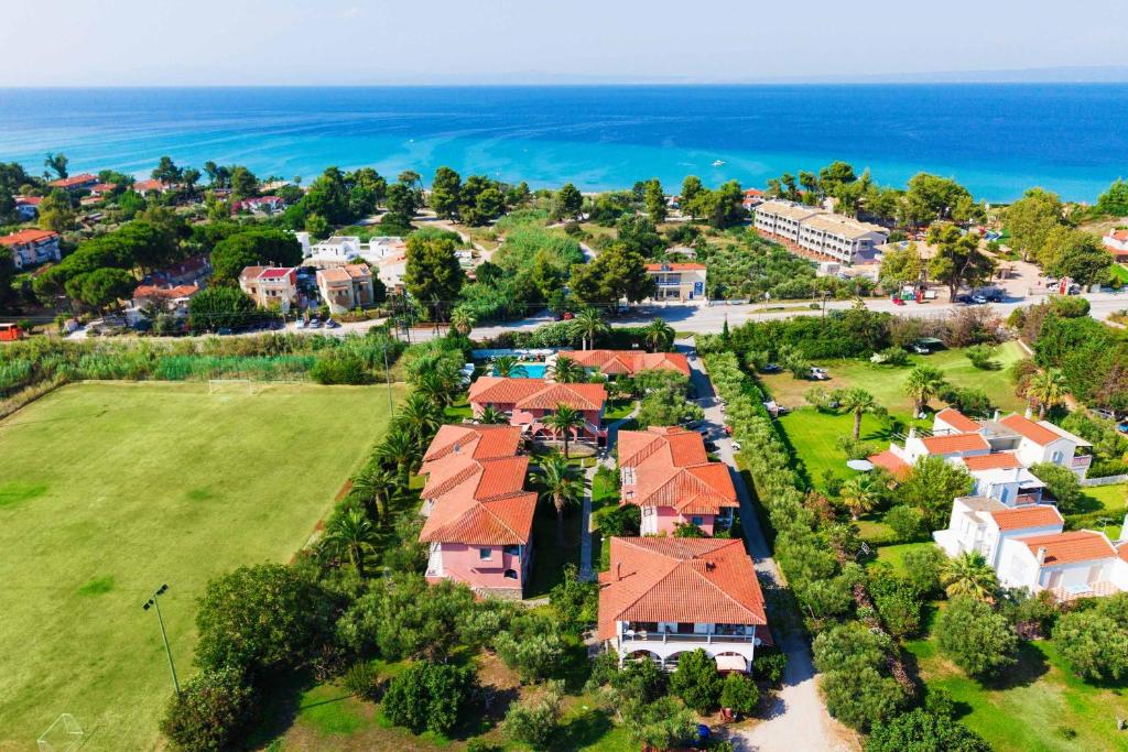 an aerial view of a house with the ocean at Hotel Hanioti Village Spa in Hanioti